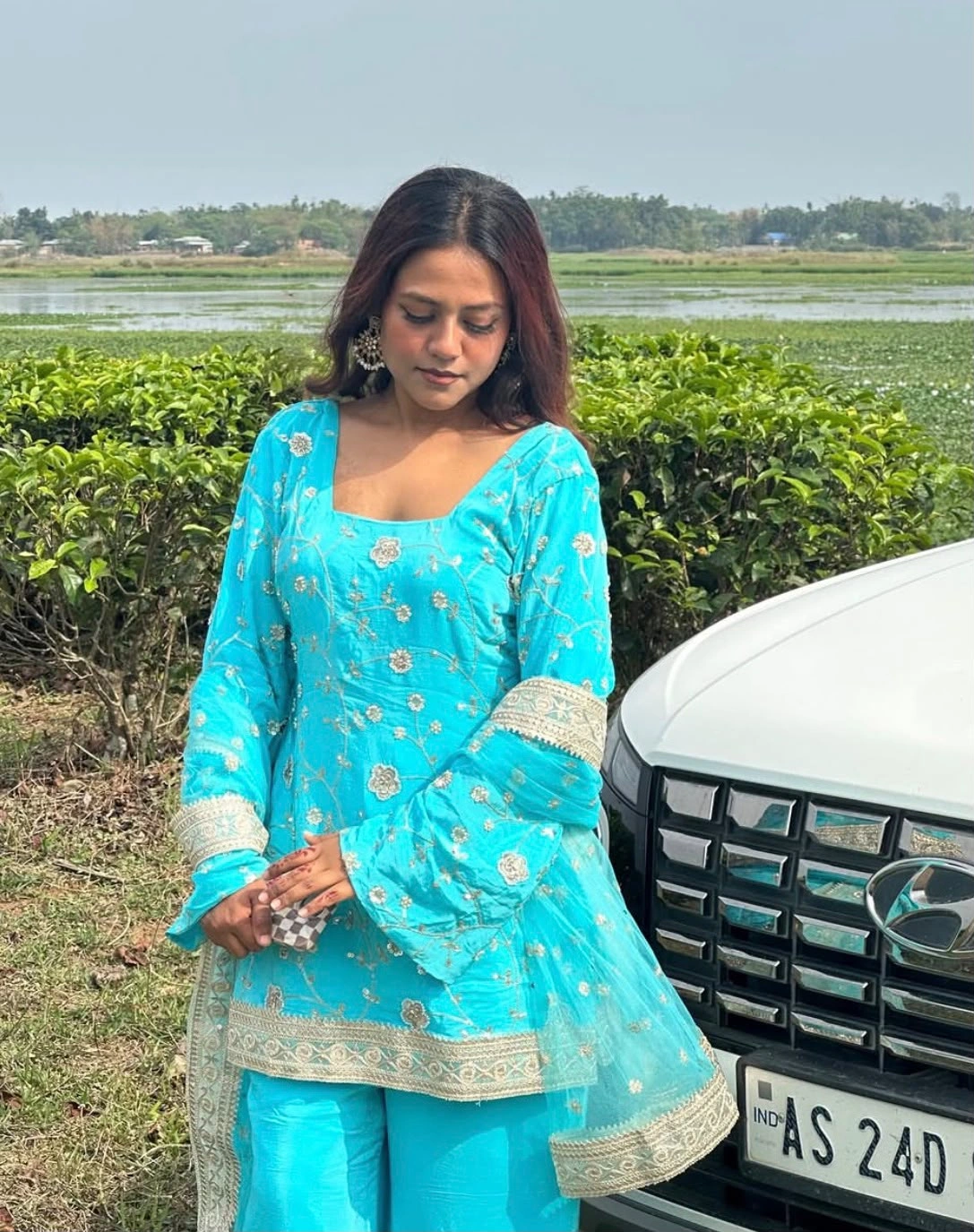 Customer wearing a custom outfit by Outfits by Deepshikhaa